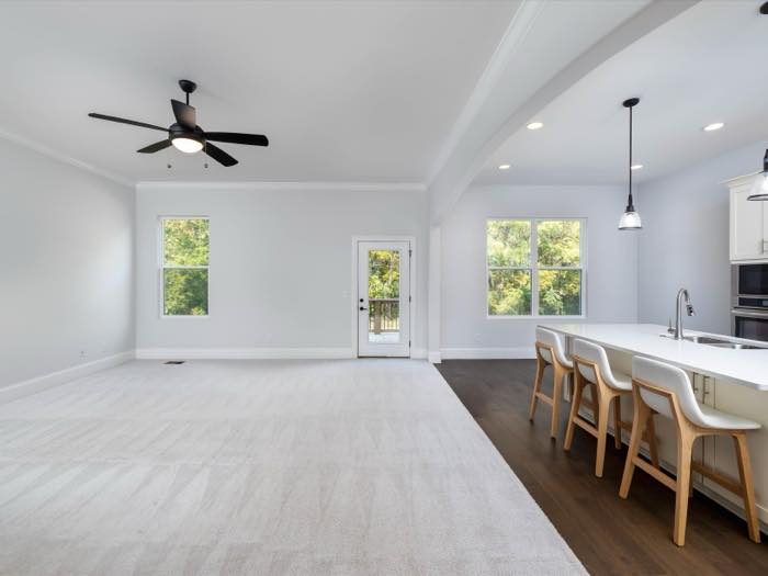 Living room, 16'9" × 21'4", with a wall of rear windows