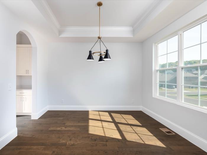 Dining room under a coffered tray ceiling