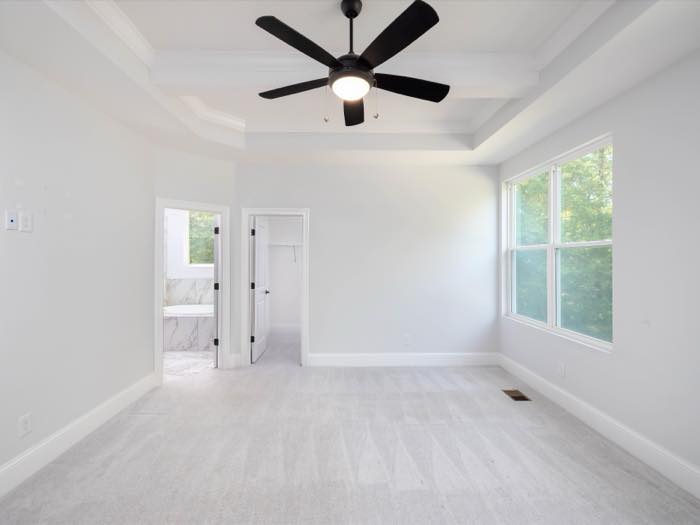 Primary bedroom with its bath and closet doors