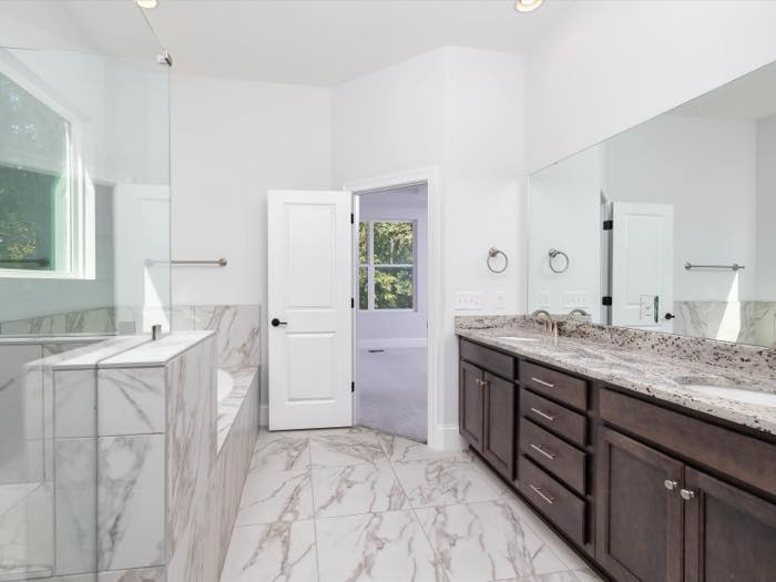Primary bath, double vanity opposite the tub
