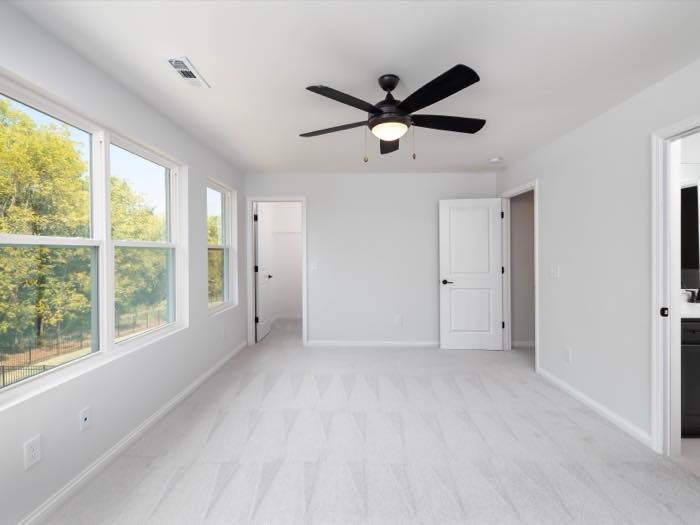Upstairs bedroom with a corner window bank